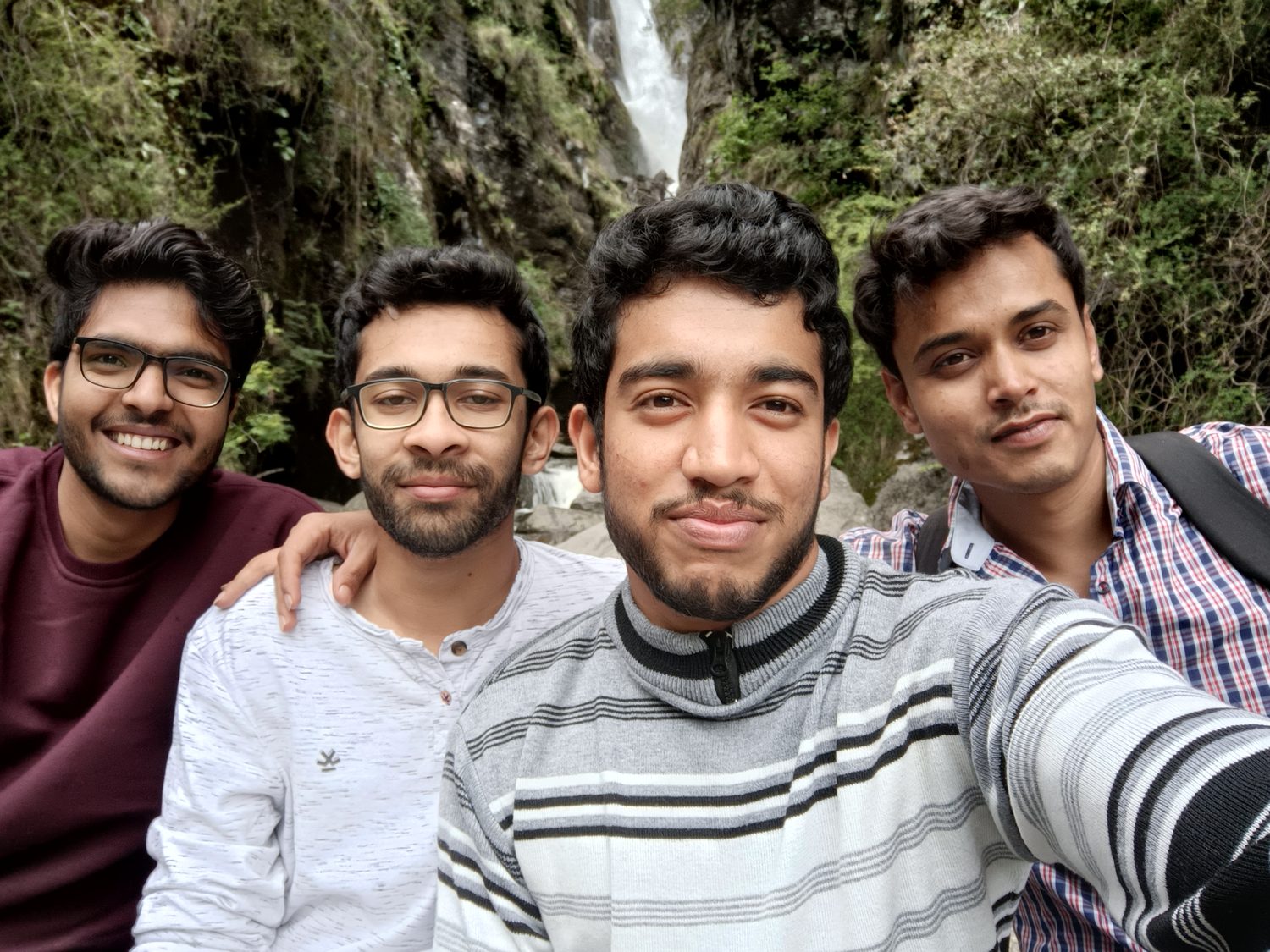 Sumit with three friends on a mountain trip.